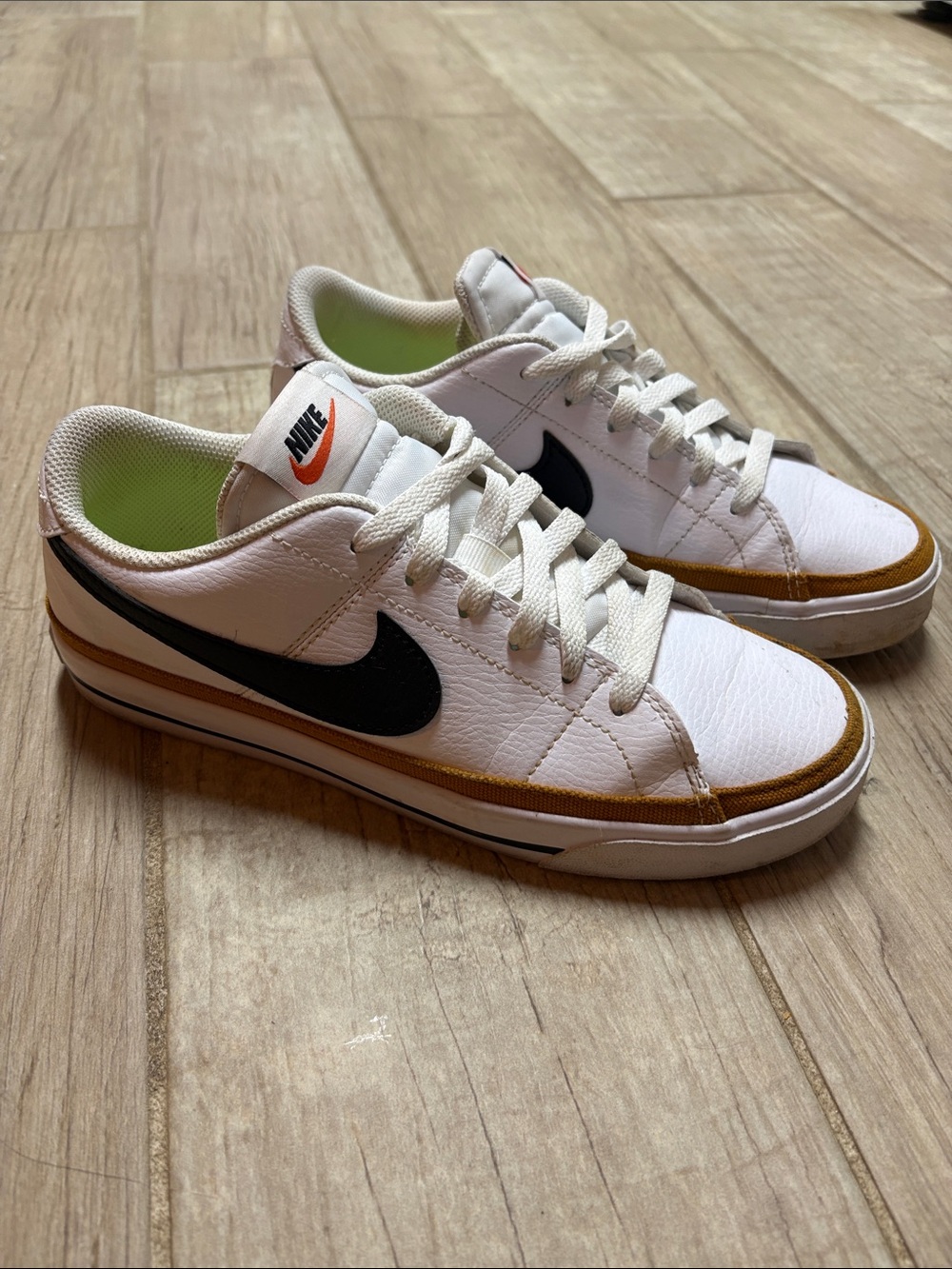 Nike Court White Sneakers with Black Swoosh and Brown Accent